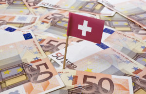 Flag of Switzerland sticking in european banknotes.(series)