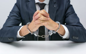 Businessman with handcuffs