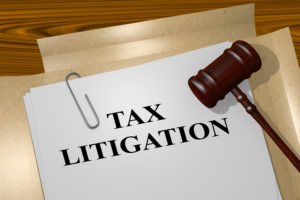 3D illustration of "TAX LITIGATION" title on legal document
